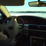 car cornering on ice lake in Sweden with ‘light touch ‘opposite lock steering